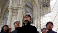 French Culture Minister Rima Abdul Malak, French Army General Jean-Louis Georgelin, French President Emmanuel Macron and Chief architect Philippe Villeneuve, wearing working helmets, visit the restoration site at the Notre-Dame de Paris Cathedral, which was damaged in a devastating fire four years ago, in Paris, France, April 14, 2023. Photo by SARAH MEYSSONNIER / POOL / AFP