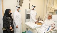 Ooredoo officials with a patient during the visit to the centre.