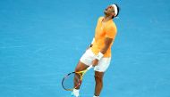 In this file photo taken on January 18, 2023 Spain's Rafael Nadal reacts as he competes against Mackenzie McDonald of the US during his men's singles match on day three of the Australian Open tennis tournament in Melbourne. Photo by Martin KEEP / AFP