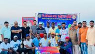 The winning team with officials.