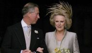 In this file photo taken on April 9, 2005 Britain's Prince Charles and his bride Camilla, Duchess of Cornwall leave St. George's Chapel in Windsor. (Photo by Alastair Grant / POOL / AFP)