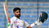 Pakistan's captain Babar Azam gestures after scoring a century (100 runs) during the first day of the first cricket Test match between Pakistan and New Zealand at the National Stadium in Karachi on December 26, 2022. (Photo by Asif Hassan / AFP)

