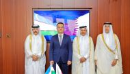 Qatar Chamber officials pose for a group photo with Minister of Investment, Industry and Trade of the Republic of Uzbekistan H E Laziz Kudratov.