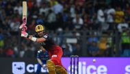 Royal Challengers Bangalore's Faf du Plessis plays a shot during the Indian Premier League (IPL) Twenty20 cricket match between Mumbai Indians and Royal Challengers Bangalore at the Wankhede Stadium in Mumbai on May 9, 2023. (Photo by Indranil Mukherjee / AFP)