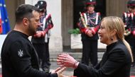 Italy's Prime Minister, Giorgia Meloni (R) greets Ukrainian President Volodymyr Zelensky upon his arrival for their meeting on May 13, 2023 at Palazzo Chigi in Rome.  Photo by Alberto PIZZOLI / AFP