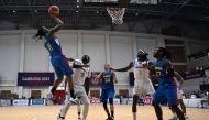 Philippines' Christopher Elijah Duque Newsome (L) shoots the ball during the men's basketball final against Cambodia at the 32nd Southeast Asian Games (SEA Games) in Phnom Penh on May 16, 2023. (Photo by Mohm Rasfan / AFP)