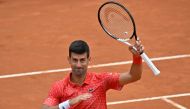 Serbia's Novak Djokovic acknowledges the public after defeating Britain's Cameron Norrie in their fourth round match of the Men's ATP Rome Open tennis tournament at Foro Italico in Rome on May 16, 2023. (Photo by Tiziana Fabi / AFP)