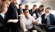 Britain's Prime Minister Rishi Sunak holds a huddle with political journalists on board of a government plane, as he heads to Japan to attend the G7 summit, in Hiroshima, on May 17, 2023. (Photo by Stefan Rousseau / POOL / AFP)
