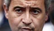 French Interior Minister and Overseas Gerald Darmanin (C) delivers remarks to journalists outside at a police station after paying tribute to three police officers from the precinct killed in a road traffic accident one day prior, in Roubaix, northern France, on May 23, 2023. Photo by Sameer Al-Doumy / AFP