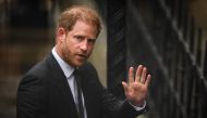 Britain's Prince Harry, Duke of Sussex waves as he arrives at the Royal Courts of Justice, Britain's High Court, in central London on March 28, 2023. Photo by Daniel Leal / AFP

