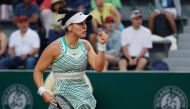 Canada's Bianca Andreescu reacts after a point to Spain's Carla Suarez Navarro during their women's singles match on day five of the Roland-Garros Open tennis tournament in Paris on June 1, 2023. Photo by Geoffroy Van der Hasselt / AFP