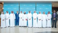 Aspire Zone Foundation officials with QU students during their visit to the facilities.