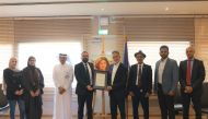 Al Jazeera officials receiving the ISO certification. 