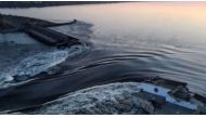 This screen grab from a video posted on Ukraine's President Volodymyr Zelensky's Twitter account on June 6, 2023 shows an aerial view of the dam of the Kakhovka Hydroelectric Power Station after it was partially destroyed. Photo by various sources / AFP