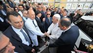 Pope Francis (R) shakes hand with Director of the department of Abdominal and Endocrine Metabolic Medical and Surgical Sciences at the Gemelli hospital, Rome on June 16, 2023,  Photo by Alberto PIZZOLI / AFP