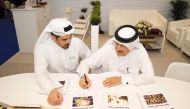 Environmental expert and engineering adviser at the Ministry of Environment and Climate Change Dr. Mohammed Saif Al Kuwari signing on the new publications at the MoECC pavilion at the DIBF.