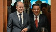 German Chancellor Olaf Scholz (L) and China's Premier Li Qiang enter the conference room to attend German-Chinese economy consultations on June 20, 2023 at the Chancellery in Berlin.
Photo by Tobias SCHWARZ / AFP