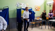 Greek former prime minister and leader of Greece's conservative party New Democracy, Kyriakos Mitsotakis leaves a voting booth at a polling station during the general election in Athens on June 25, 2023. (Photo by ANGELOS TZORTZINIS / AFP)