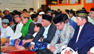 Indonesian Ambassador to Qatar H E Ridwan Hassan (third right) with the Indonesian community members during an Eid Al Adha family gathering.