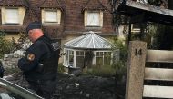 A Police officer stands in front of the house of the Mayor of l'Hay-les-Roses Vincent Jeanbrun, Paris suburb on July 2, 2023. Photo by Nassim GOMRI / AFP
