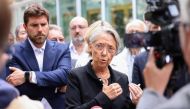 :French Prime Minister Elisabeth Borne addresses journalists in front of the Mayor of L'Hay-les-Roses, Vincent Jeanbrun (L), after rioters rammed a vehicle into his house overnight, in L'Hay-les-Roses, south of Paris on July 2, 2023. (Photo by CHARLY TRIBALLEAU / POOL / AFP)
