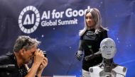 A photographer takes a picture of CEO female robot 