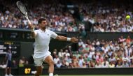 Serbia's Novak Djokovic returns the ball to Poland's Hubert Hurkacz during their men's singles tennis match on the eighth day of the 2023 Wimbledon Championships at The All England Tennis Club in Wimbledon, southwest London, on July 10, 2023. Photo by Adrian DENNIS / AFP