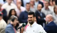 Serbia's Novak Djokovic speaks during an interview after winning against Italy's Jannik Sinner during their men's singles semi-finals tennis match on the twelfth day of the 2023 Wimbledon Championships at The All England Lawn Tennis Club in Wimbledon, southwest London, on July 14, 2023. (Photo by SEBASTIEN BOZON / AFP) /