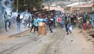 Protestors clash with Kenyan police officers during anti-government protests in Nairobi on July 19, 2023. Kenya braced on July 19, 2023 for a new round of protests despite the government warning it would not tolerate further unrest after earlier demonstrations turned violent with more than a dozen people killed. (Photo by Tony KARUMBA / AFP)
