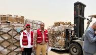 QRCS officials with some of the consignments for the displaced people in Sudan.