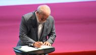 Brazilian President Luiz Inacio Lula da Silva signs the federal government's PAC (Growth Accelerated Program) during its launching ceremony at the Municipal Theater in Rio de Janeiro, Brazil on August 11, 2023. (Photo by MAURO PIMENTEL / AFP)
