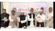Officials presenting the Mansoor Azmi’s poetry collection book.