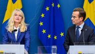 Sweden's Security Police Chief Charlotte von Essen (left) and Sweden's Prime Minister Ulf Kristersson address a press conference as the terror threat level in Sweden was raised to four on a five-point scale in Stockholm on August 17, 2023, following recent Quran burnings. (Photo by Henrik Montgomery / various sources / AFP) 