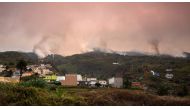 A wildfire rages out of control through forested slopes in La Matanza on the Canary island of Tenerife on August 19, 2023. Photos by DESIREE MARTIN / AFP