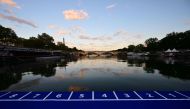 This photograph taken on August 20, 2023, shows the starting line dedicated to the swim familiarisation event of the 2023 World Triathlon Olympic Games Test Event floating on the Seine river with the Eiffel Tower in the background ahead of the mixed relay 2023 World Triathlon Olympic Games Test Event in Paris. Photo by Emmanuel DUNAND / AFP