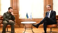 Greece's Prime Minister Kyriakos Mitsotakis (right) meets with Ukraine's President Volodymyr Zelensky at Maximou mansion in Athens, on August 21, 2023. (Photo by Angelos Tzortzinis / AFP)
