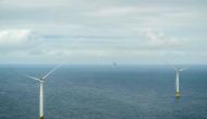 A view out of an aircraft shows offshore wind engines during a flight of Norway's Crown Prince and Norway's Prime Minister to attend the inauguration of the Hywind Tampen floating offshore wind farm, situated between energy company Equinor's oil and gas fields Snorre and Gullfaks in the Norwegian North Sea off the coast of Bergen on August 23, 2023. Photo by Ole Berg-Rusten / NTB / AFP