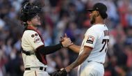 Patrick Bailey #14 and Camilo Doval #75 of the San Francisco Giants celebrate defeating the Atlanta Braves 8-5 at Oracle Park on August 27, 2023 in San Francisco, California. (Photo by Thearon W. Henderson / GETTY IMAGES NORTH AMERICA / Getty Images via AFP)
