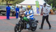 Kenya's President William Ruto uses an electric motorcycle during the national launch of an electric motorcycle project dubbed e-bodaboda at Kenyan Coastal city of Mombasa on September 1, 2023.(Photo by AFP)