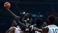 South Sudan's Nuni Omot (2L) shoots the ball during the FIBA Basketball World Cup match between Angola and South Sudan at Smart Araneta Coliseum in Quezon City on September 2, 2023. (Photo by JAM STA ROSA / AFP)
