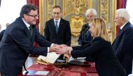 File photo: Italy's new Economy Minister Giancarlo Giorgetti shakes hands with Italy's Prime Minister Giorgia Meloni during the swearing-in ceremony at the Quirinale Presidential Palace, in Rome, Italy, October 22, 2022. (Italian Presidency/Handout via REUTERS)

