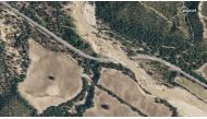 This handout satellite image released on September 9, 2023 by Planet Labs PBC shows an aerial view of a destroyed bridge in Aldea del Fresno, on September 5, 2023 after heavy rains and floods.  Photo by Handout / Planet Labs PBC / AFP 