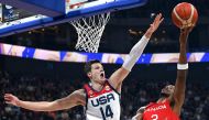 USA's Walker Kessler (L) tries to block Canada's Shai Gilgeous-Alexander (R) during the FIBA Basketball World Cup in Manila on September 10, 2023. (Photo by JAM STA ROSA / AFP)