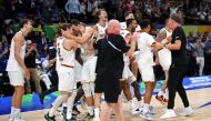 Germany's team celebrates after winning the FIBA Basketball World Cup final game against Serbia in Manila on September 10, 2023. (Photo by Ted Aljibe / AFP)