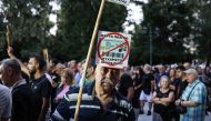 Greeks demonstrate against the issuing of the new biometric identity cards that the government has decided to put into circulation, in Athens on September 10, 2023.  (Photo by Aris Oikonomou / AFP)
