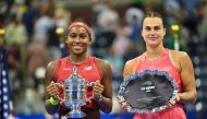 USA's Coco Gauff and Belarus's Aryna Sabalenka hold their trophies after Gauff won the US Open tennis tournament women's singles final match at the USTA Billie Jean King National Tennis Center in New York on September 9, 2023. (Photo by Angela Weiss / AFP)
