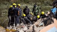 Moroccan rescuers search the rubble for survivors in Talat N'Yacoub village of al-Haouz province in earthquake-hit Morocco on September 11, 2023. (Photo by Fadel Senna / AFP)