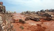 People look at the damage caused by freak floods in Derna, eastern Libya, on September 11, 2023. (Photo by AFP)