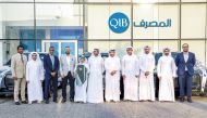 QIB and Visa officials pose for a group photo with the winners.