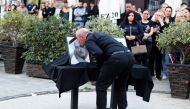 Kosovo Serbs gather in the northern part of Mitrovica on September 26, 2023 to pay their respect and light candles for the gunmen killed in the clashes with Kosovo police near the border with Serbia during the weekend. (Photo by STRINGER / AFP)